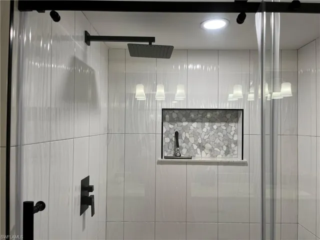 Details featuring a shower with door