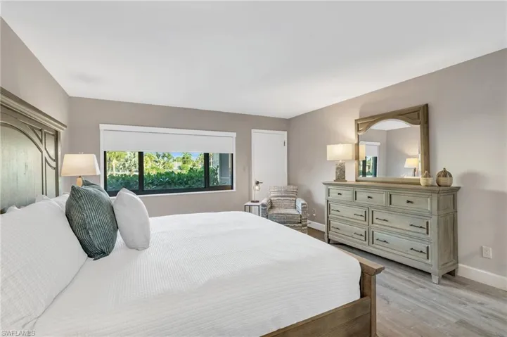 Bedroom with light hardwood / wood-style flooring