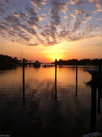 Property view of water with a dock
