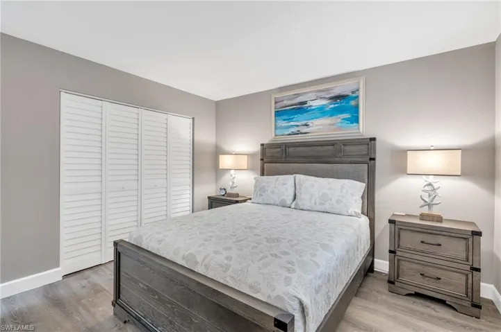 Bedroom featuring wood-type flooring