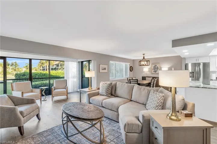 Living room featuring light hardwood / wood-style floors and a chandelier