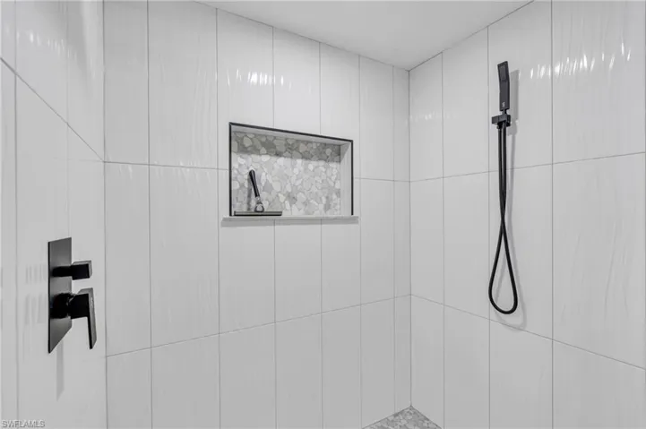 Interior details featuring tiled shower