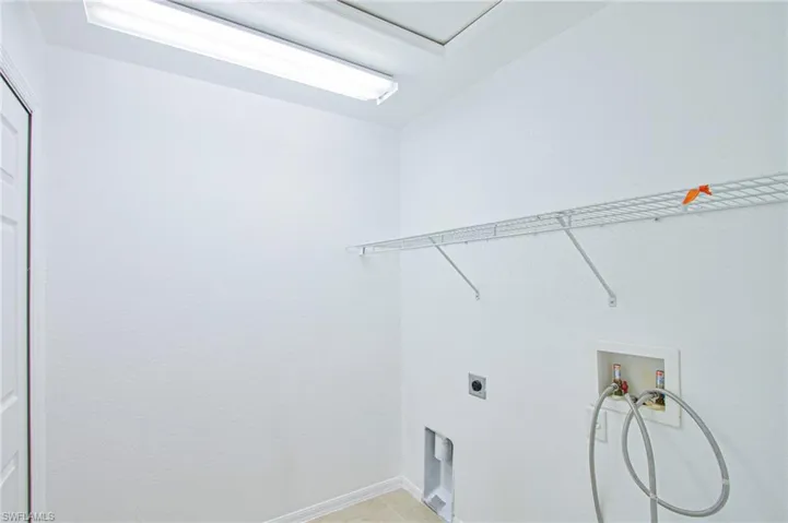 Laundry room with washer hookup and hookup for an electric dryer