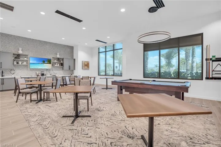 Playroom featuring recessed lighting, visible vents, light wood finished floors, and baseboards
