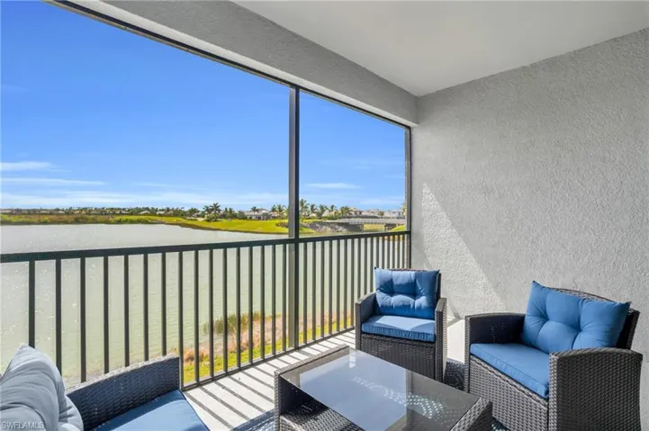 Sunroom / solarium featuring outdoor lounge area and a water view