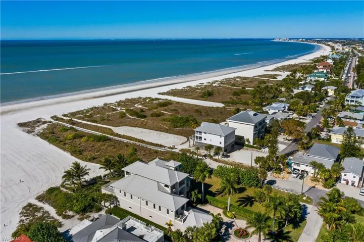Aerial view with a beach view and a water view