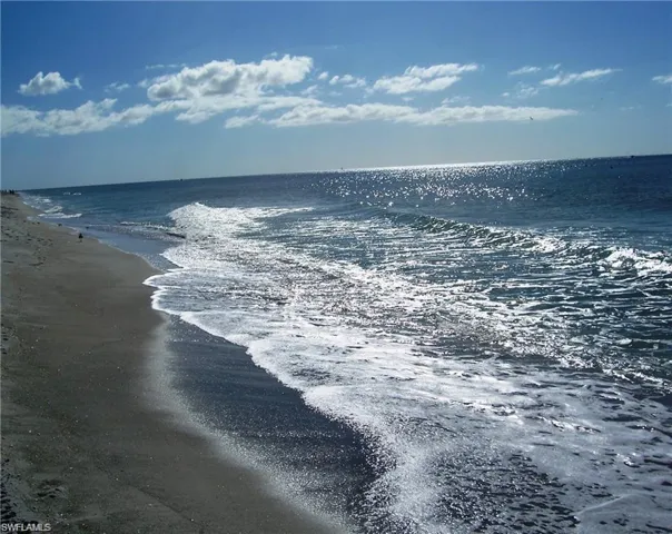 View of water feature with a beach view