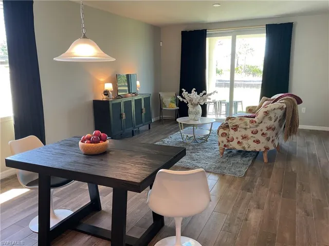 Dining room with baseboards and wood finished floors