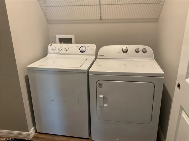 Laundry room featuring washing machine and dryer and laundry area