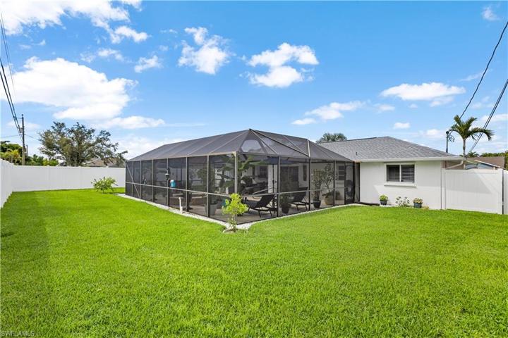 plenty of backyard with newer, white 6' privacy fence