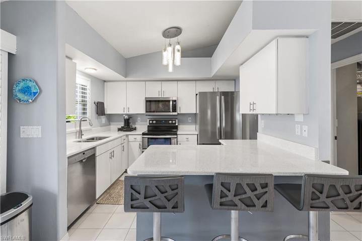 Beautifully updated kitchen with newer appliances, new light fixtures, and more!