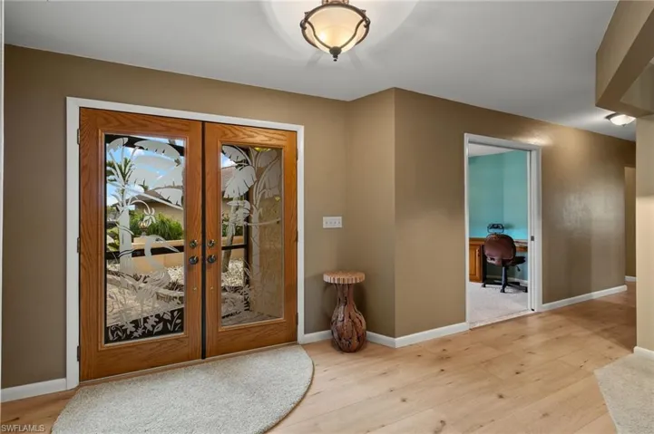Entryway featuring light hardwood / wood-style flooring and french doors