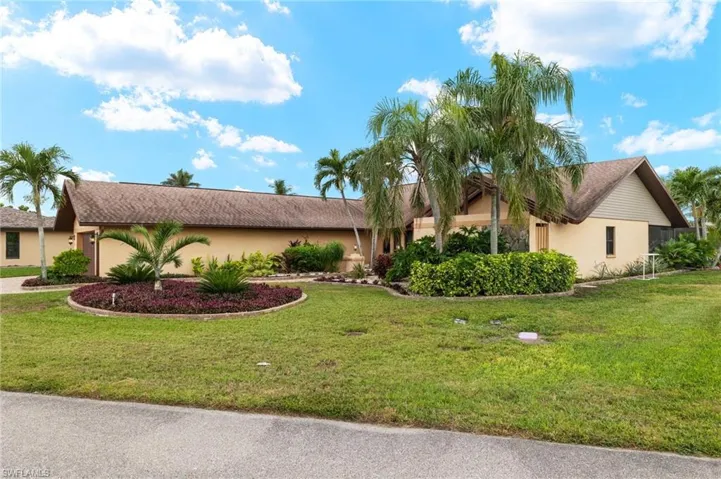View of front of house with a front yard