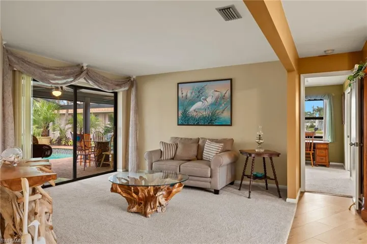 Living room with light hardwood / wood-style floors