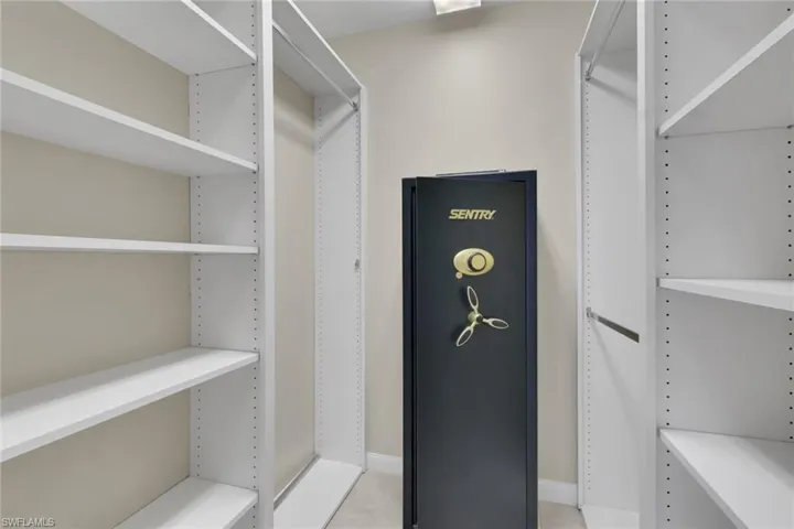 Custom closet system featuring multiple adjustable shelves and hanging rods