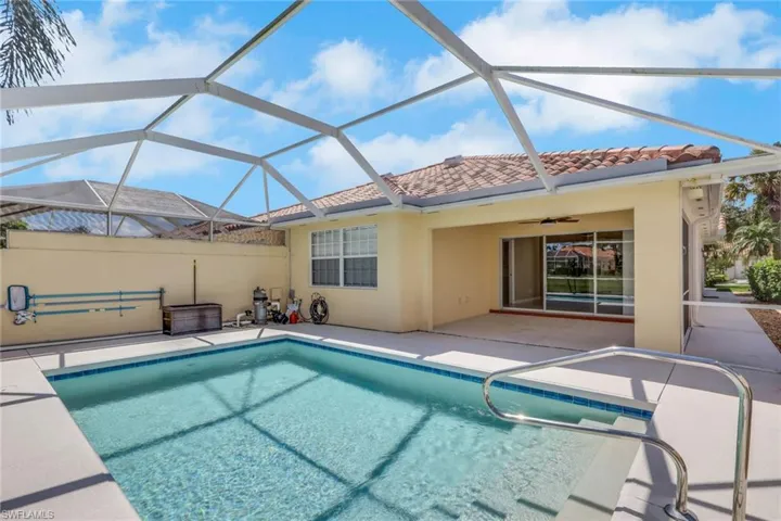 Screened enclosure over a rectangular pool with a handrail