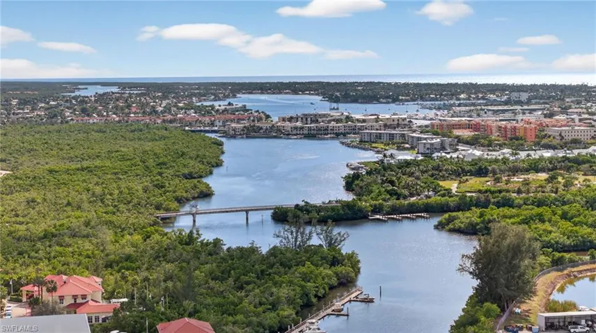 View of urban area with a notable bridge and a large body of water