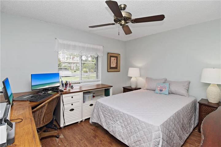 Guest bedroom has plenty of room for desk