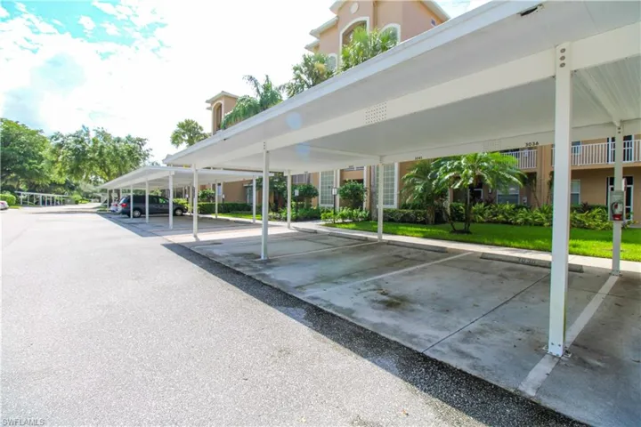View of car parking featuring a carport