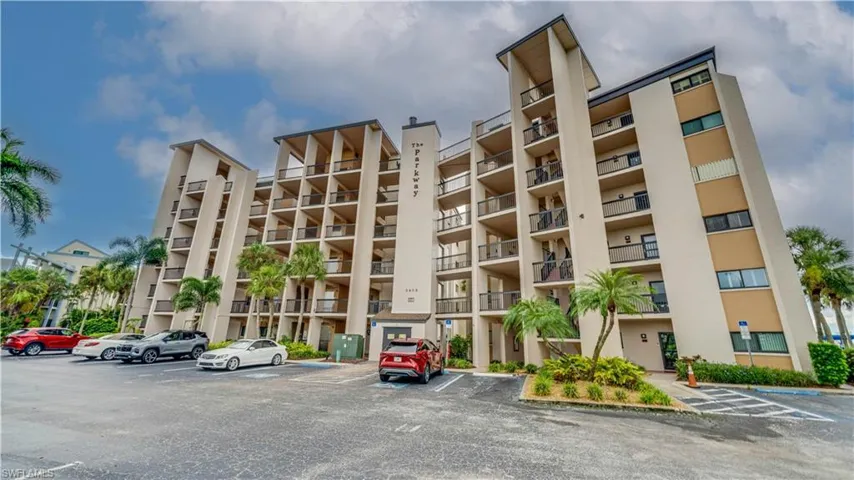 Multi-story building with multiple balconies and exterior lighting