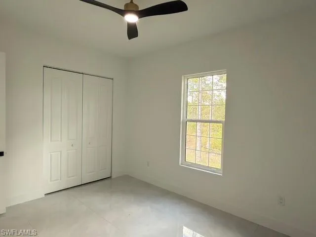 Bathroom with toilet and baseboards