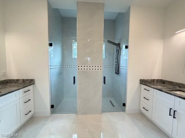Spare room with a raised ceiling, recessed lighting, and ceiling fan