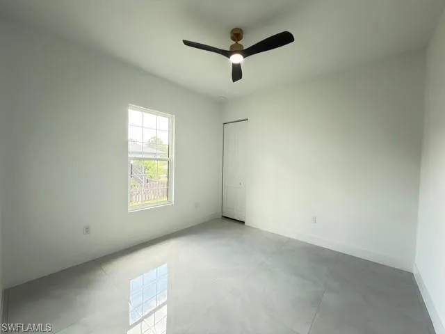 Bathroom featuring a walk in shower and vanity