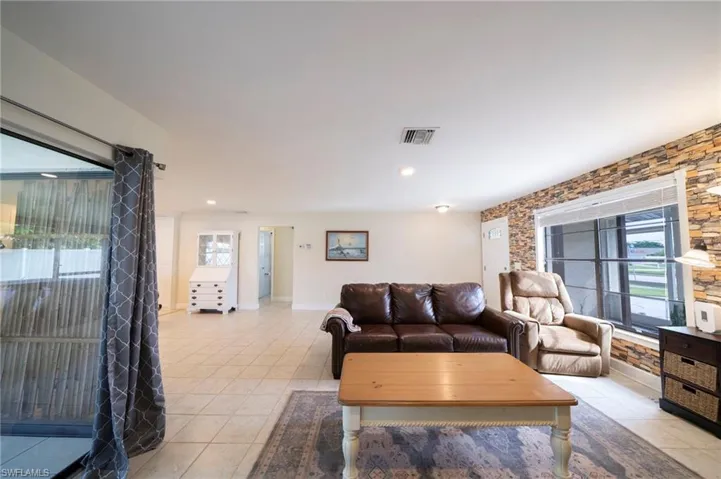 Living area with light tile patterned floors