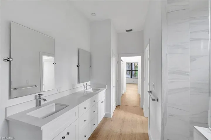 Bathroom with hardwood / wood-style floors and vanity