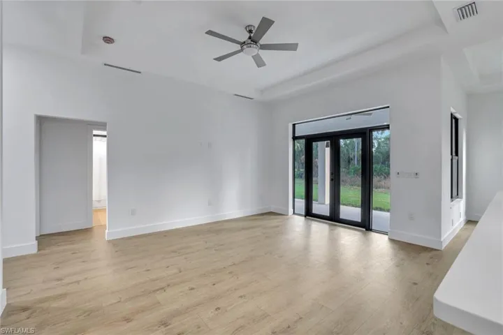 Empty room featuring ceiling fan and light hardwood / wood-style floors