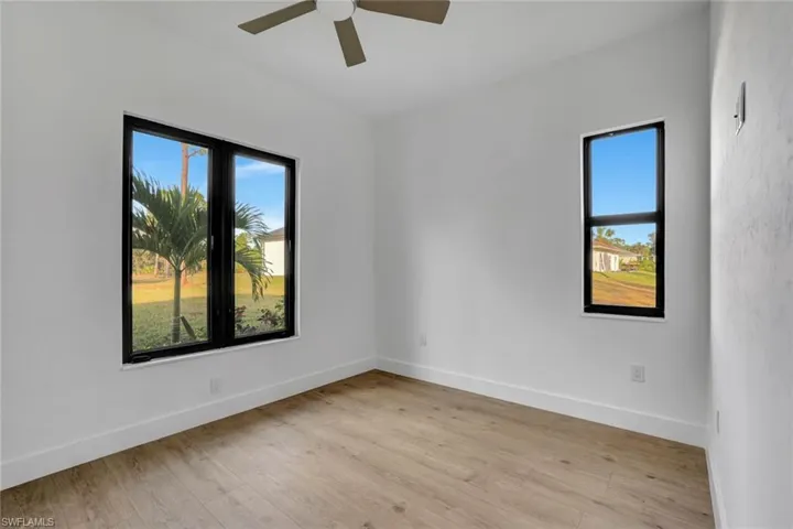 Unfurnished room featuring light hardwood / wood-style floors and ceiling fan