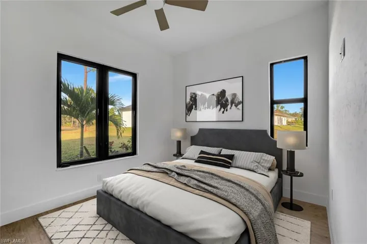 Virtually Staged_Bedroom featuring ceiling fan and light hardwood / wood-style floors