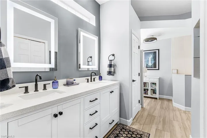 Master bathroom with duel sinks stand-up shower and private potty closet.