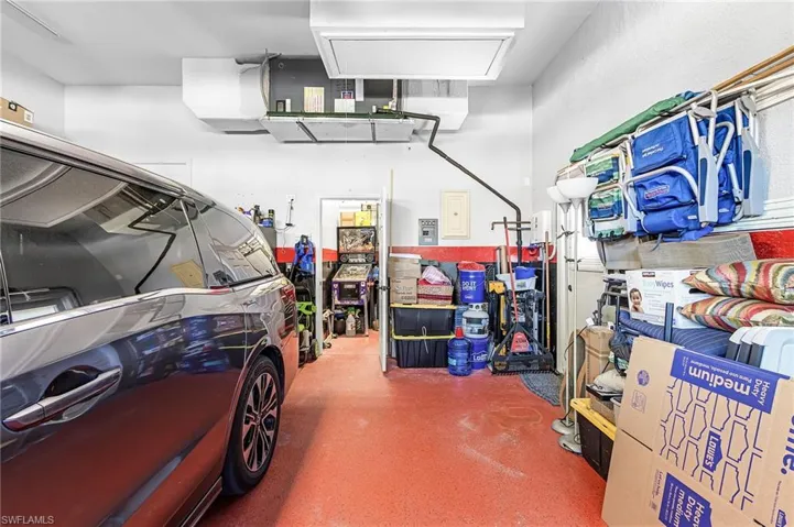 Over sized two bay garage has epoxy floor finish, side entry door and deep design for larger vehicles or additional storage.