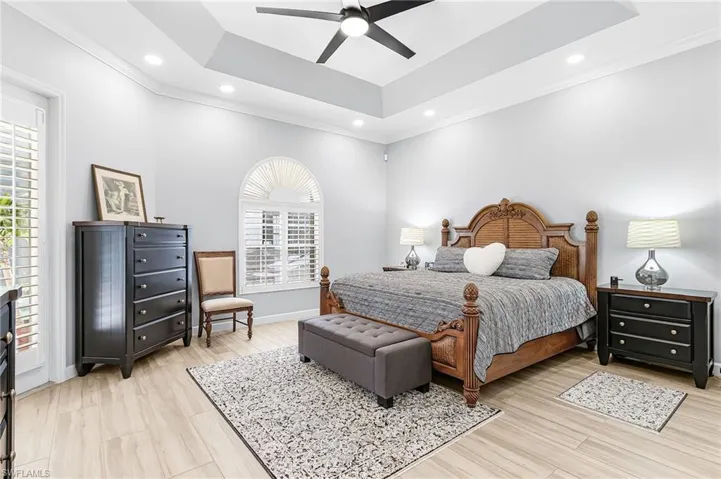 Master Retreat offering very open floor space, French doors to the pool deck with ample accent lighting.