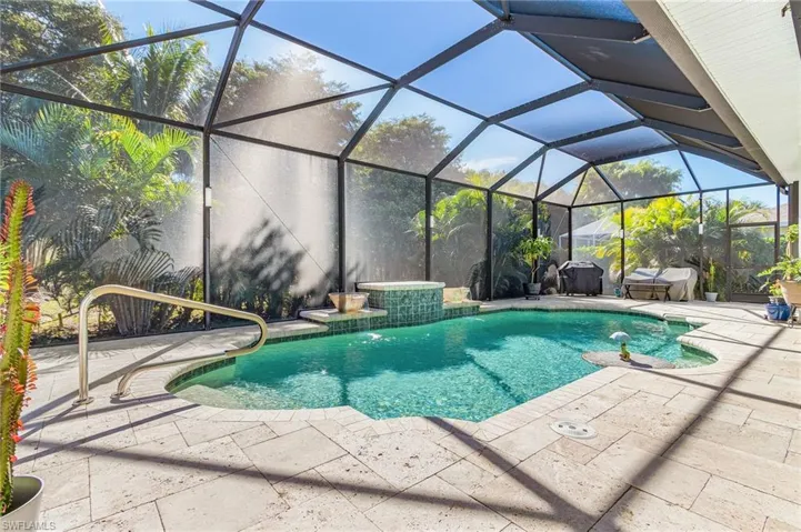 Well designed, vibrant pool area offering hours of relaxation.  Premium, ruff cut marble decking material for an impressive finish to a very inviting space.