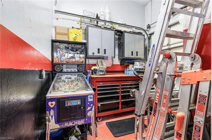 Extra room to the rear of the garage for a perfect workshop.  Room also has a garage door perfect for lawn equipment, motorcycle or extra storage with easy access.