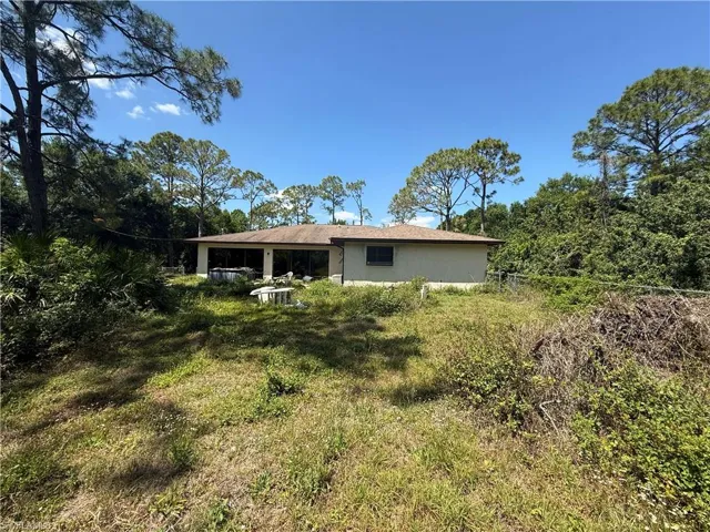 Rear view of house with stucco siding