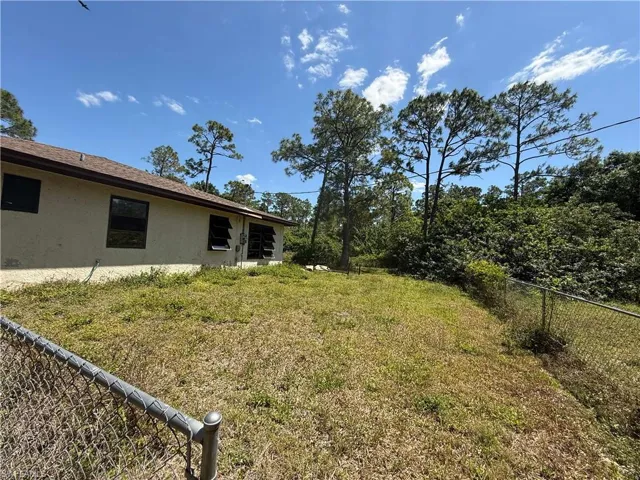 Right side view of yard with fence
