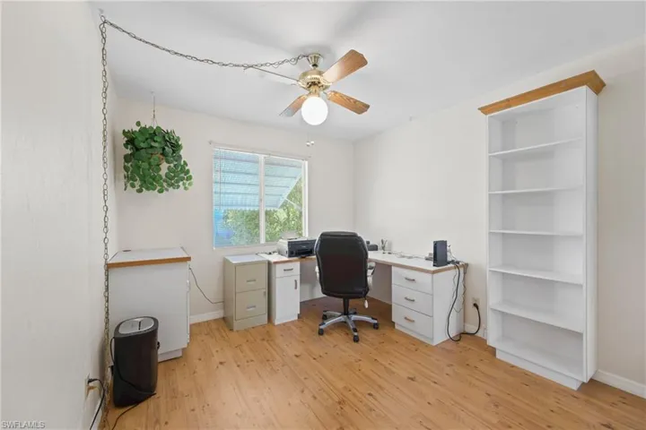 Office area featuring light hardwood / wood-style floors and ceiling fan