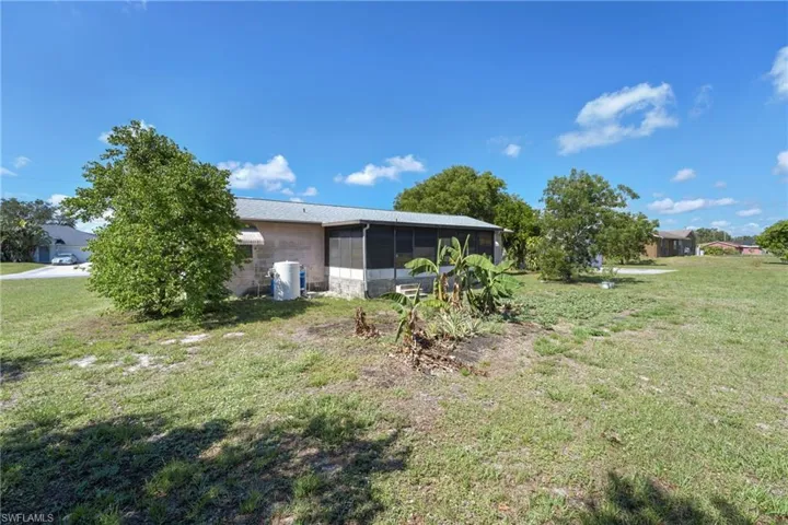 View of yard with a sunroom