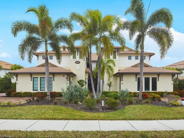 This coach home boasts coastal curb appeal and is only one of few units to share a driveway with just one other unit, rather than two.
