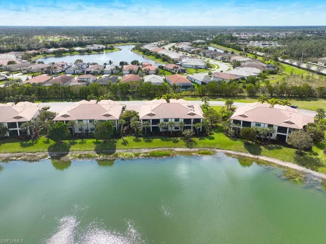 Expansive aerial view showcasing the vibrant neighborhood and waterfront scenery.