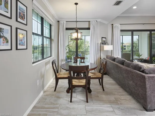 The breakfast nook is conveniently next to the kitchen and towards the back of the living area, complete with its own balcony access through sliding glass doors and views of the lake.