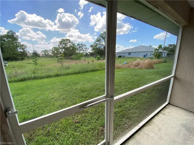 View of backyard from screened in lanai.