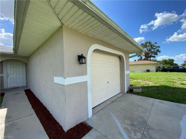 Single car garage on both sides includes a long driveway.
