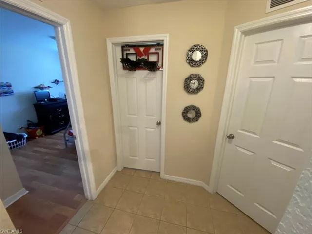 Hallway connecting bedrooms 1, 2, guest bathroom and big linen closet.