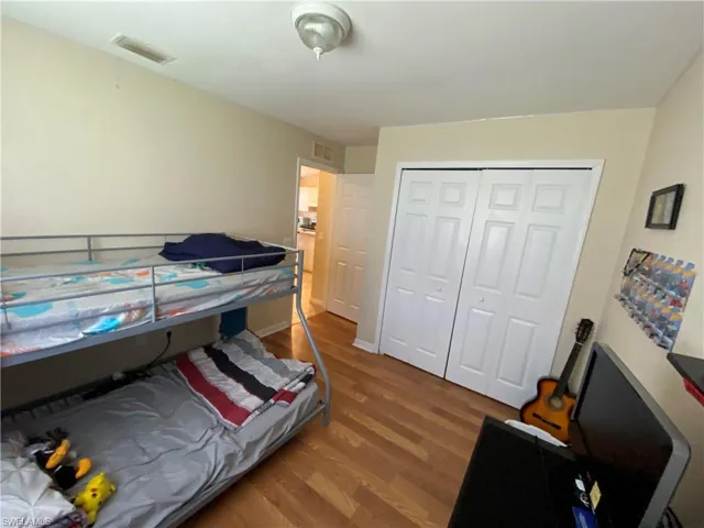 Bedroom #1 from inside showing double door closet.