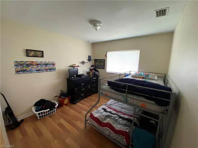 Bedroom #1. Snap Flooring and big window.