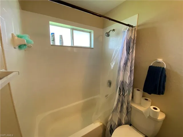 Guest bathroom includes tub and shower.